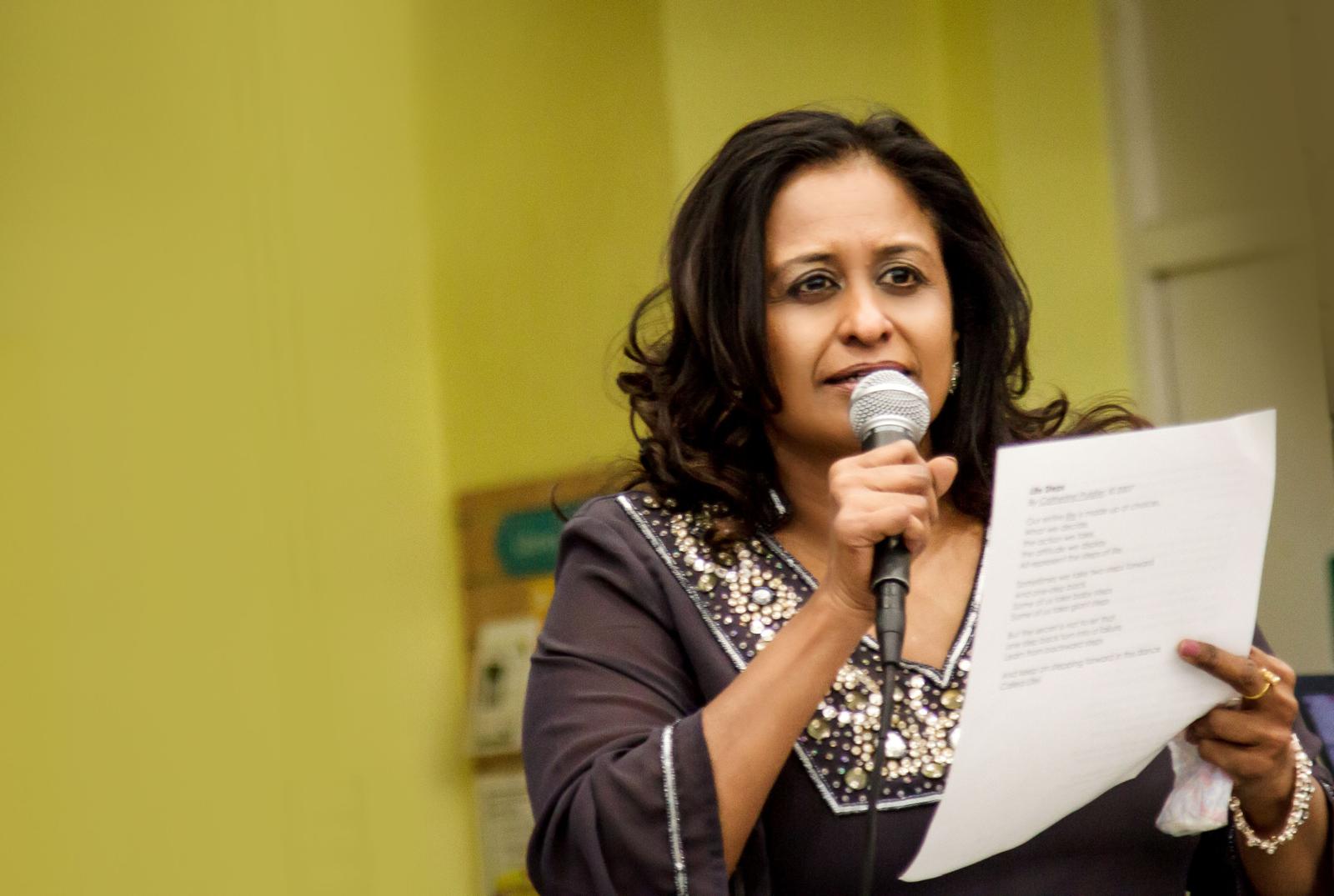 Usha Oliver reading a poem during a coaching session